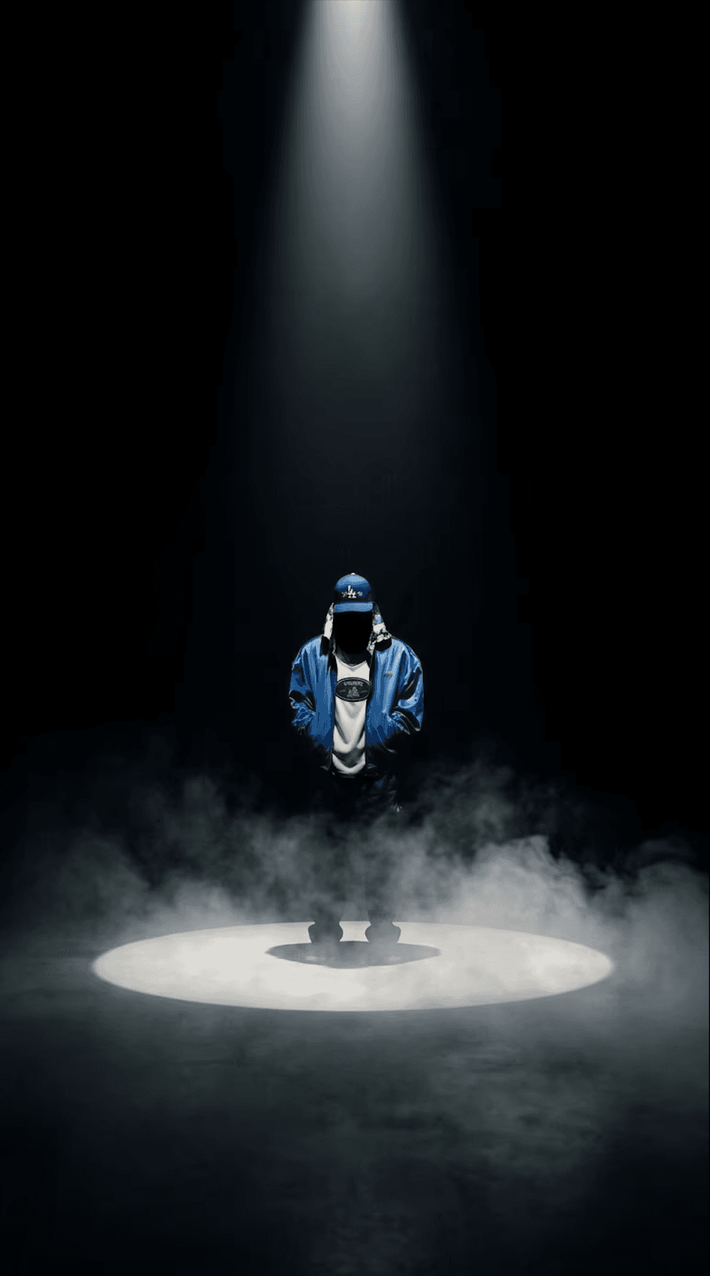 NOWHERE ELSE — figure in blue bomber under a spotlight
